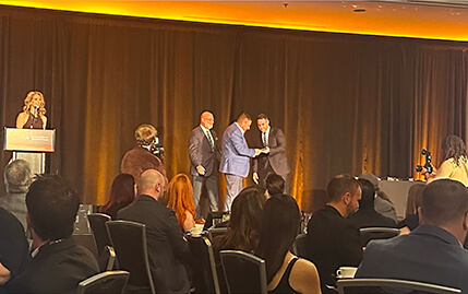 STACK Cybersecurity CEO accepting GTIA Diversity Award