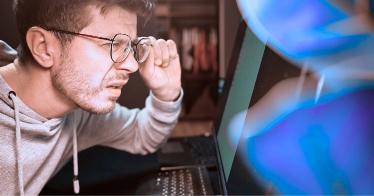 Man taking glasses off like he does not belive what he sees