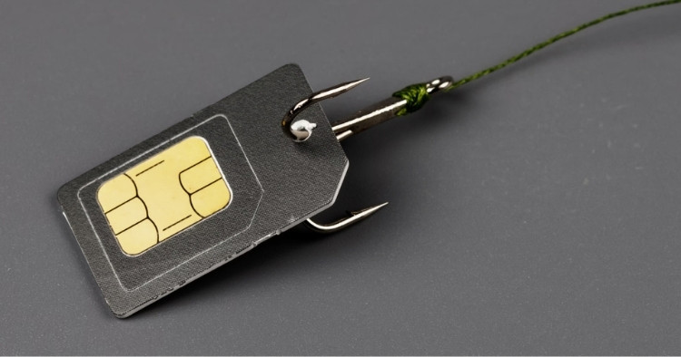 Fishook caught on a SIM card representing the dangers of SIM swapping and phishing