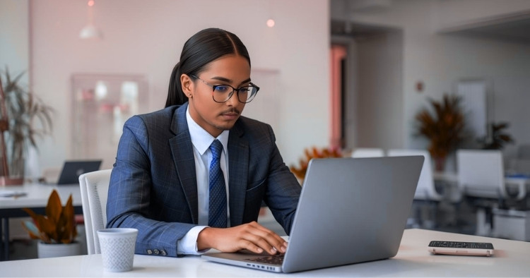 Business professional comparing AI platform pricing on a laptop in a corporate office setting.