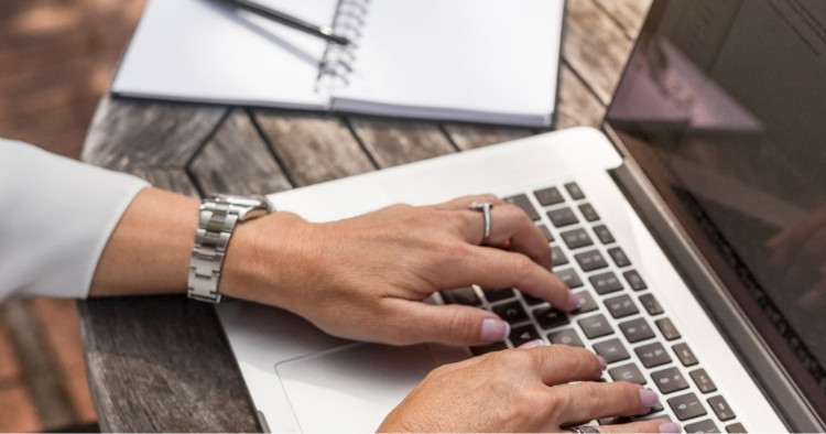 Woman typing on laptop