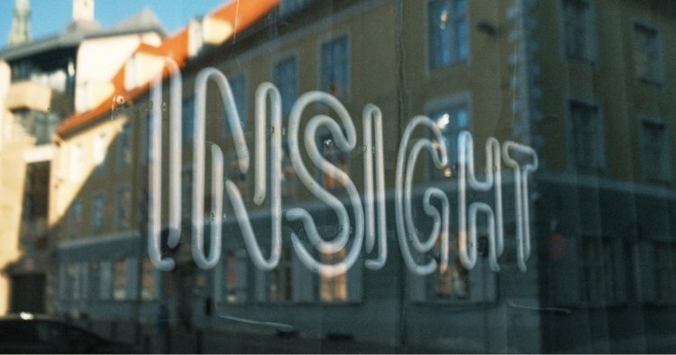 Neon light sign reading 'INSIGHT' that is turned off